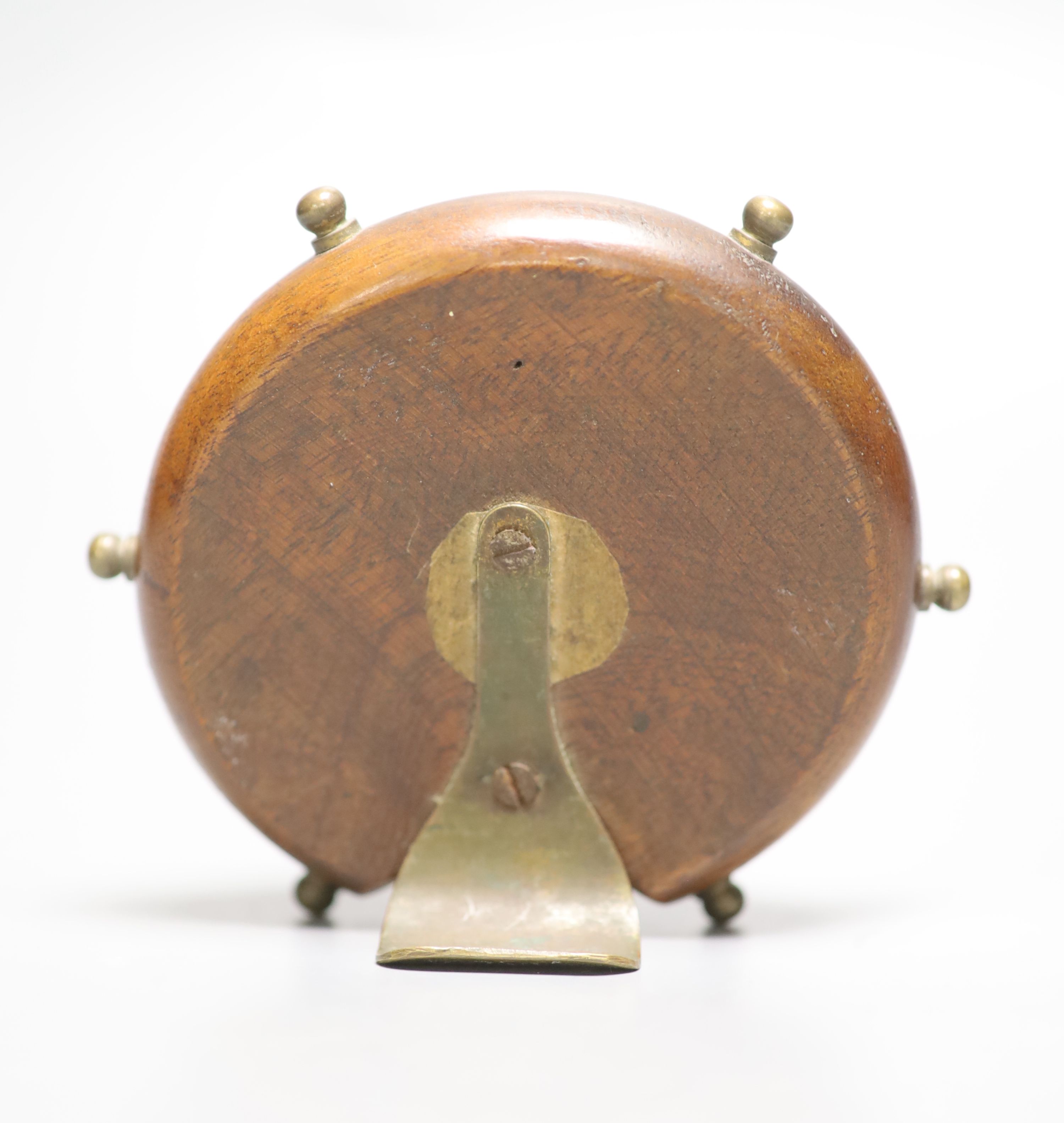 A novelty mahogany and brass framed timepiece, in the form of a ships wheel